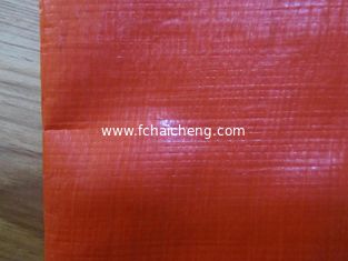 14*14 mesh orange color PE tarpaulin for trailer cover and truck cover