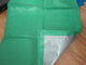 green and silver laminated tarps with rope reinforced