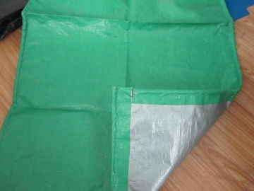 green and silver laminated tarps with rope reinforced